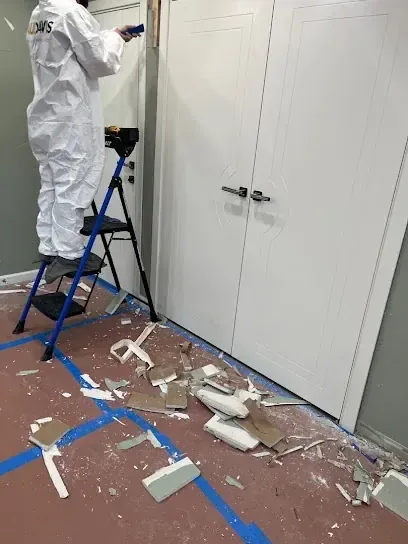 A technician prepping a room for cleanup in a Rockingham County home