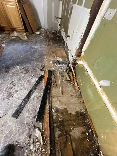 A wall opened low to dry the cavity in a Rockingham County home