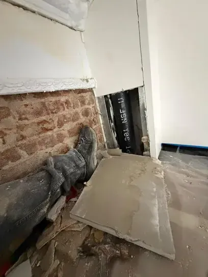 Drywall removed to reach trapped water in a Rockingham County home