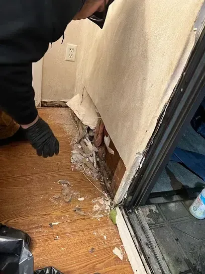 A baseboard pulled after a floor leak in a Rockingham County home