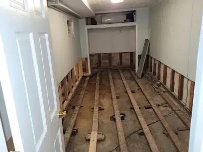 Standing water and framing in a Madison crawl space