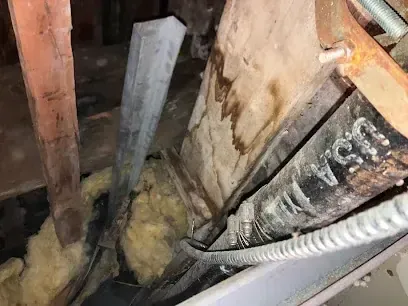 Frozen and split water pipe in an unheated Rockingham County crawl space