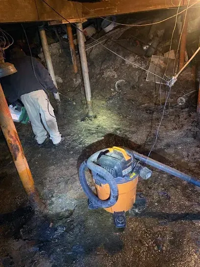 Technician extracting standing water from a Madison floor